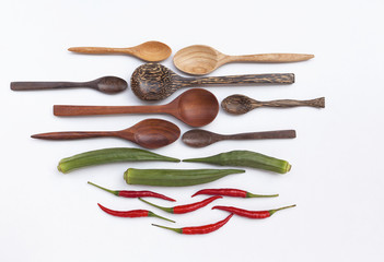 Wooden spoon set and vegetable on white background