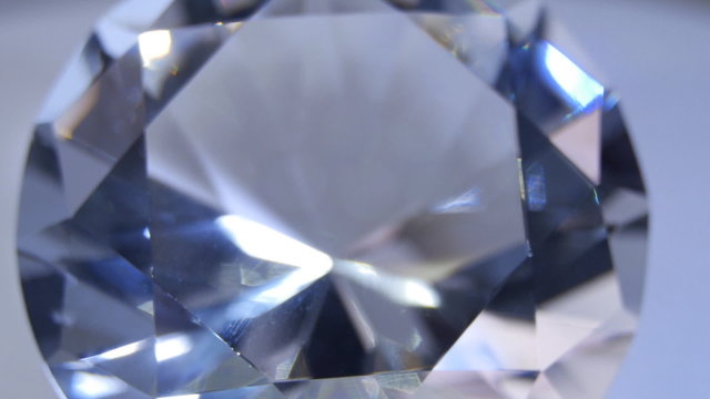 Facets of a diamond sparkle the bright light