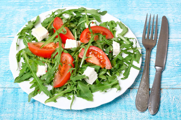 healthy salad of arugula, cheese and tomato 