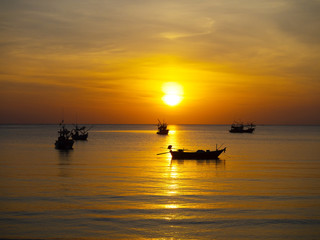 Fototapeta na wymiar the tropical sea with coloful sunrise on the sky