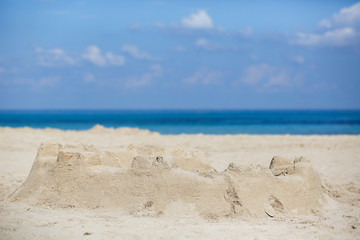 Fototapeta na wymiar Sand castle on a sandy beach