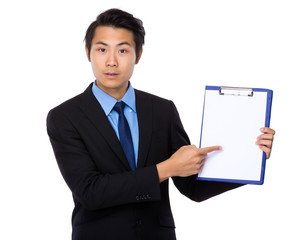 Businessman finger point to clipboard