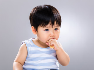 Asian baby boy with finger food
