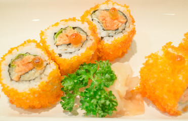 Smoked salmon sushi roll on plate