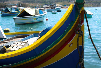 Fototapeta na wymiar traditional luzzu boats in Marsaxlokk