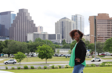 African American woman on Austin, Texas cityscape