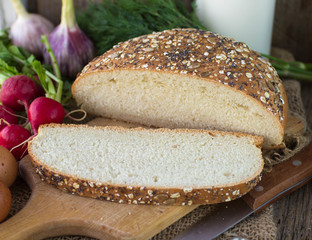 freshly baked wheat bread on a wooden Board