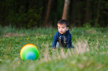 little boy playing with ball