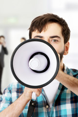 Man shouting with a megaphone.