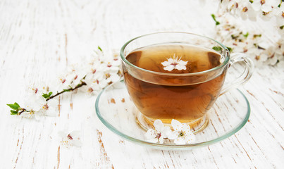 Cup of tea and spring blossom