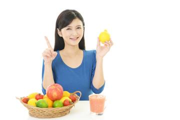 Obraz premium 果物を持つ女性