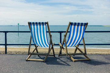 Two deck chairs by the seaside