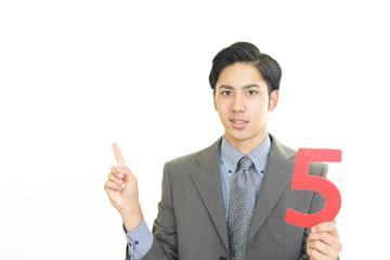 数字を持つビジネスマン