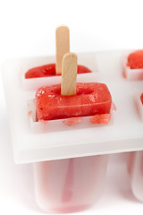 Frozen Strawberry Fruit Bars on white background.