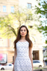 Young beautiful woman in white dress