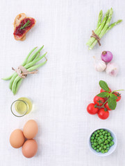 Italian food background, with vine tomatoes, asparagus, basil, s