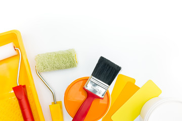 brush, rollers, tray, paint can with color samples