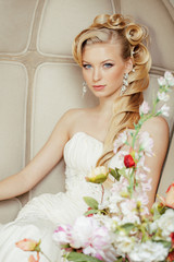 beauty young bride alone in luxury vintage interior with a lot o