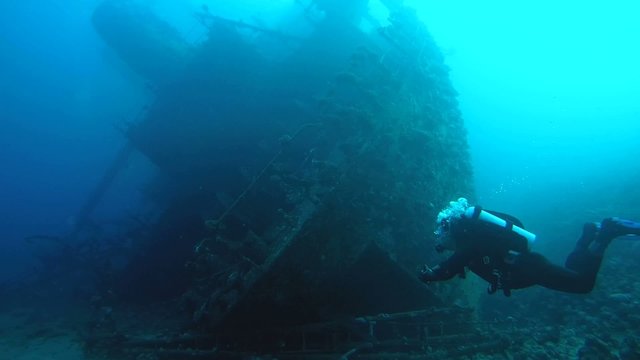 Diver visiting the stern of the wreck Giannis D, Red Sea 