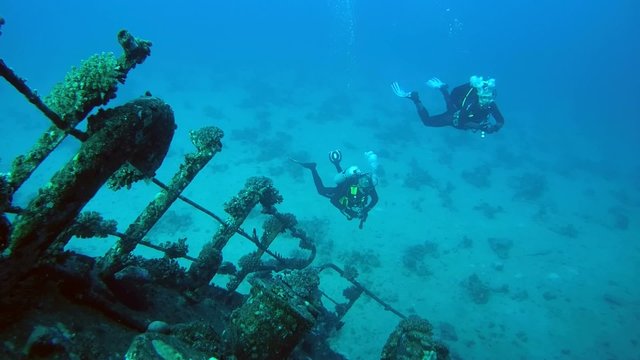 Divers visiting the wreck Giannis D, Red Sea 
