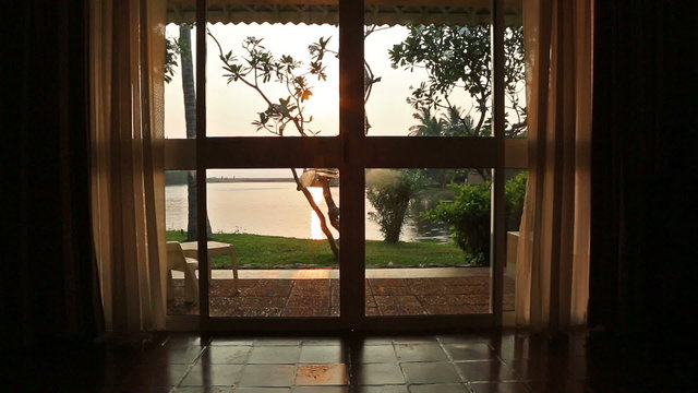 View from the room window on the lake and sunset
