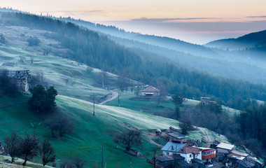 Sunrise over small village in Rhodope Mountain. Bulgaria.
