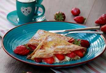 Crepes with cheese cream and fruits