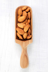 Almond on white wooden table