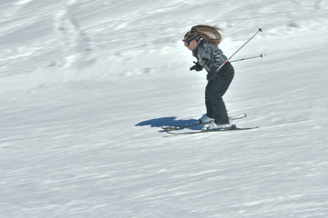 Fototapeta na wymiar Teenage girl skiing in Austria