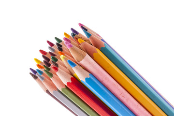 Colourful wooden crayons on white background.
