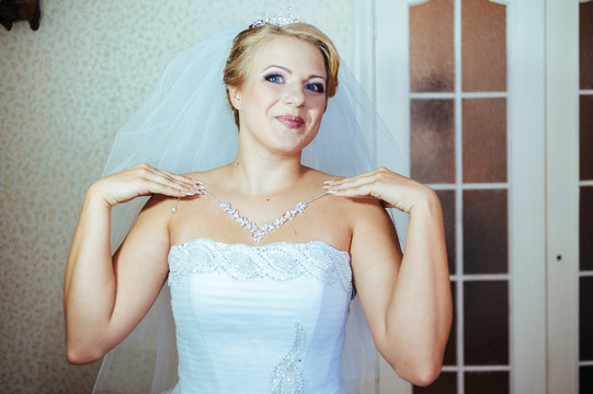 Beautiful caucasian bride getting ready for the wedding ceremony