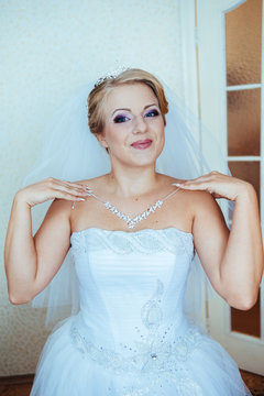 Beautiful caucasian bride getting ready for the wedding ceremony