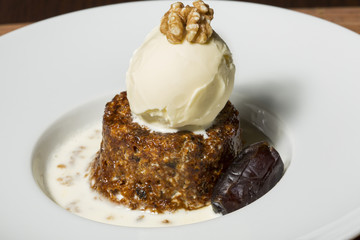 Date and walnut dessert with vanilla ice cream