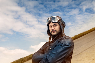 Retro Pilot Portrait with Glasses and Vintage Helmet