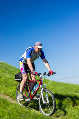 Fototapeta premium Cyclist Riding the Bike