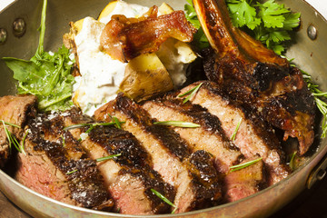 Delicious bone in rib eye steak served in steel pan