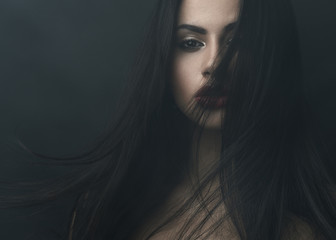 mysterious portrait of a girl in  dark  fog