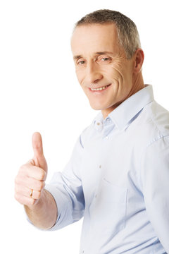 Mature man gesturing ok sign
