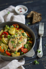 chicken fillet with bread crumbs and baked vegetables