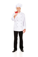 Male chef with chilli peppers