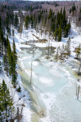 Frozen river in the mountains of the Salair ridge