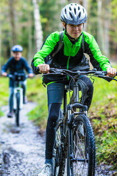 Healthy lifestyle - teenage girl and boy biking 
