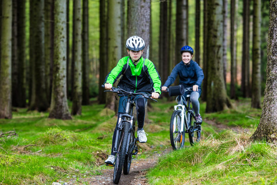 Healthy lifestyle - teenage girl and boy biking 