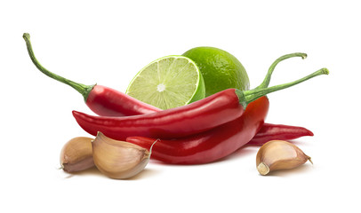 Red hot chilie pepper, garlic cloves, lime isolated on white