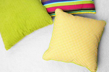 Decorative pillows on plaid close up