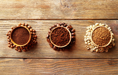 Various of coffee in small dishes on wooden table, top view