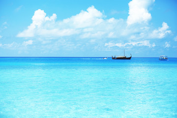 View of beautiful blue ocean water with ship in resort