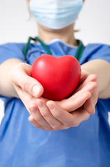 Doctor holding a heart shape