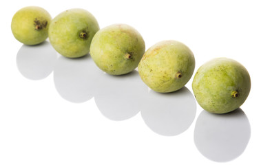 Green mango over wicker background