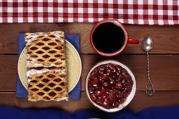 Baking, tea and jam on wooden table top view